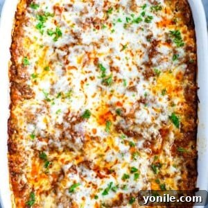 Meat Lasagna in a white dish, ready to be served.