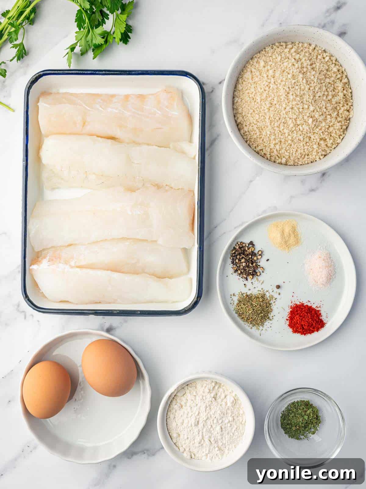 Baked Cod With Panko Bread Crumbs Ingredients laid out on a kitchen counter.